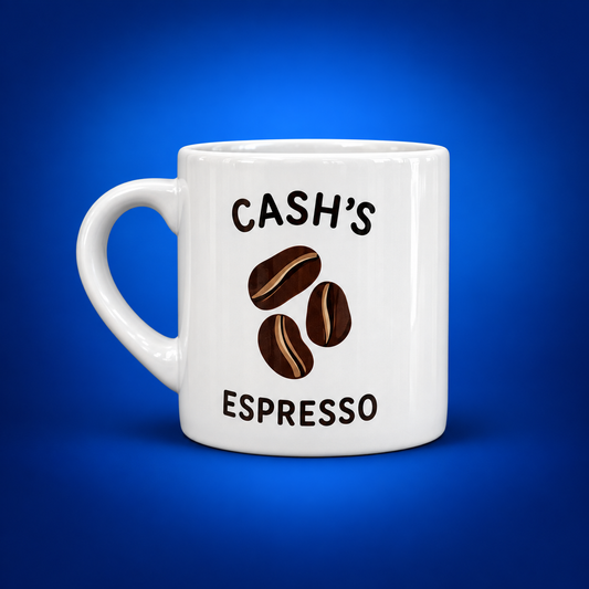 White 6 oz espresso mug personalized with Cash's Espresso text and three coffee beans on a blue background